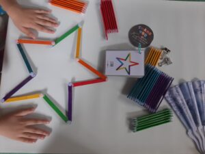 kid hand playing velcro stick puzzle